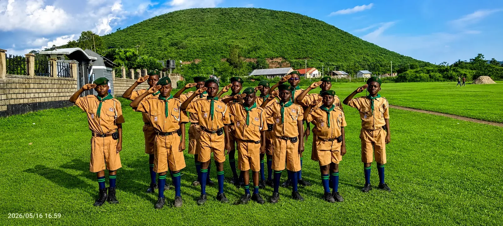 Scouts saluting on the parade field